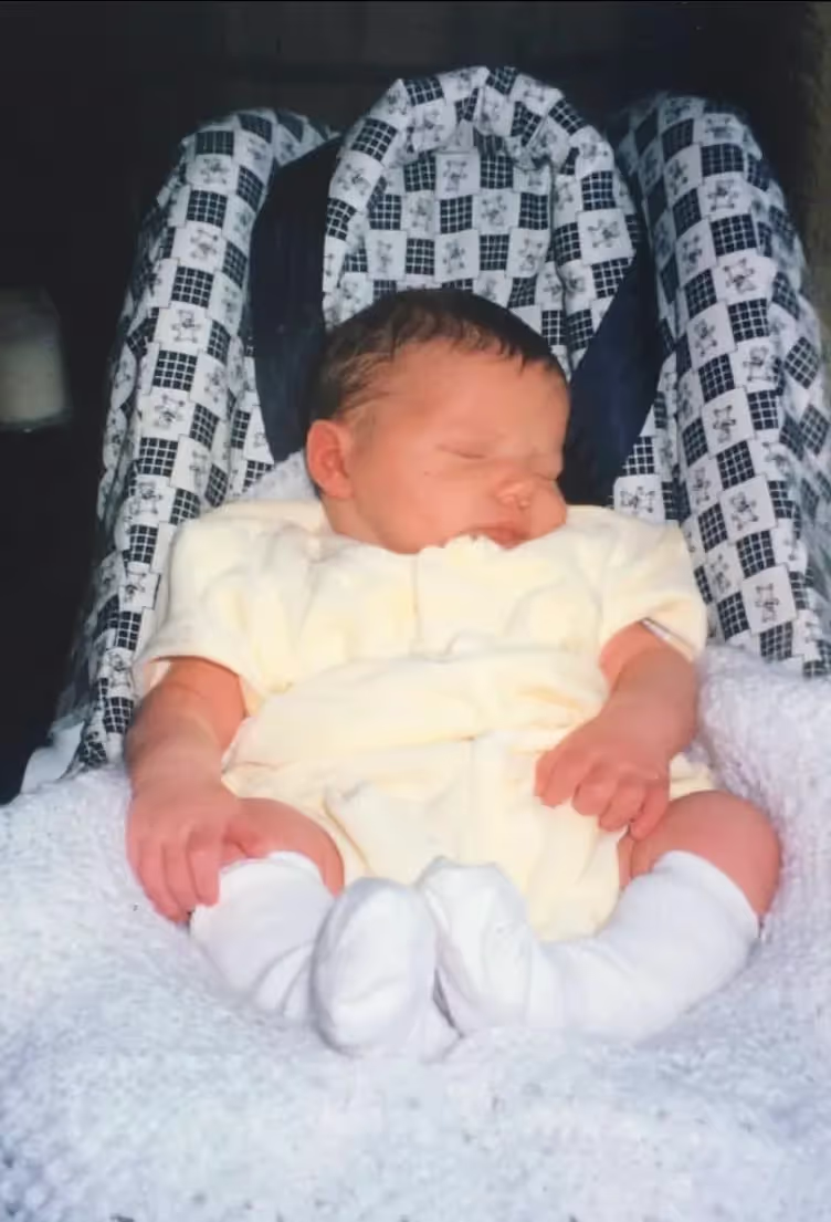 Marley as a baby in a car seat