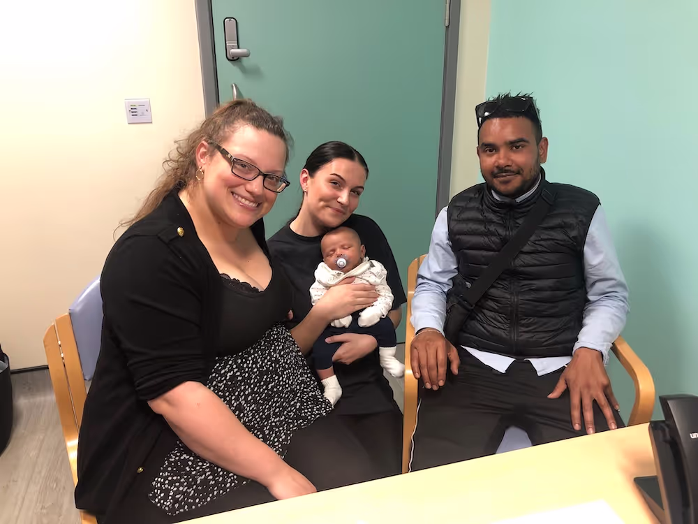Marley with a family and their new baby